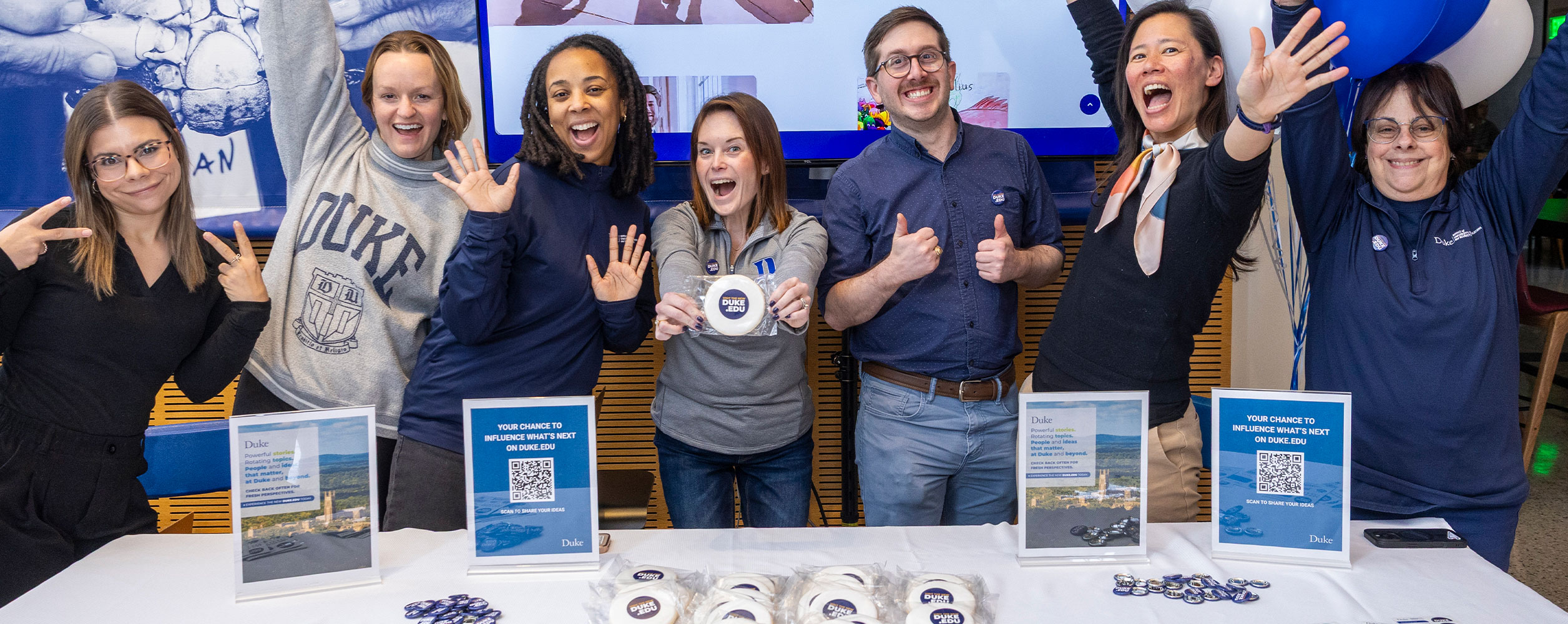 Members of Duke's Communications, Marketing & Public Affairs team celebrate the launch of the new Duke.edu homepage during a campus engagement event.